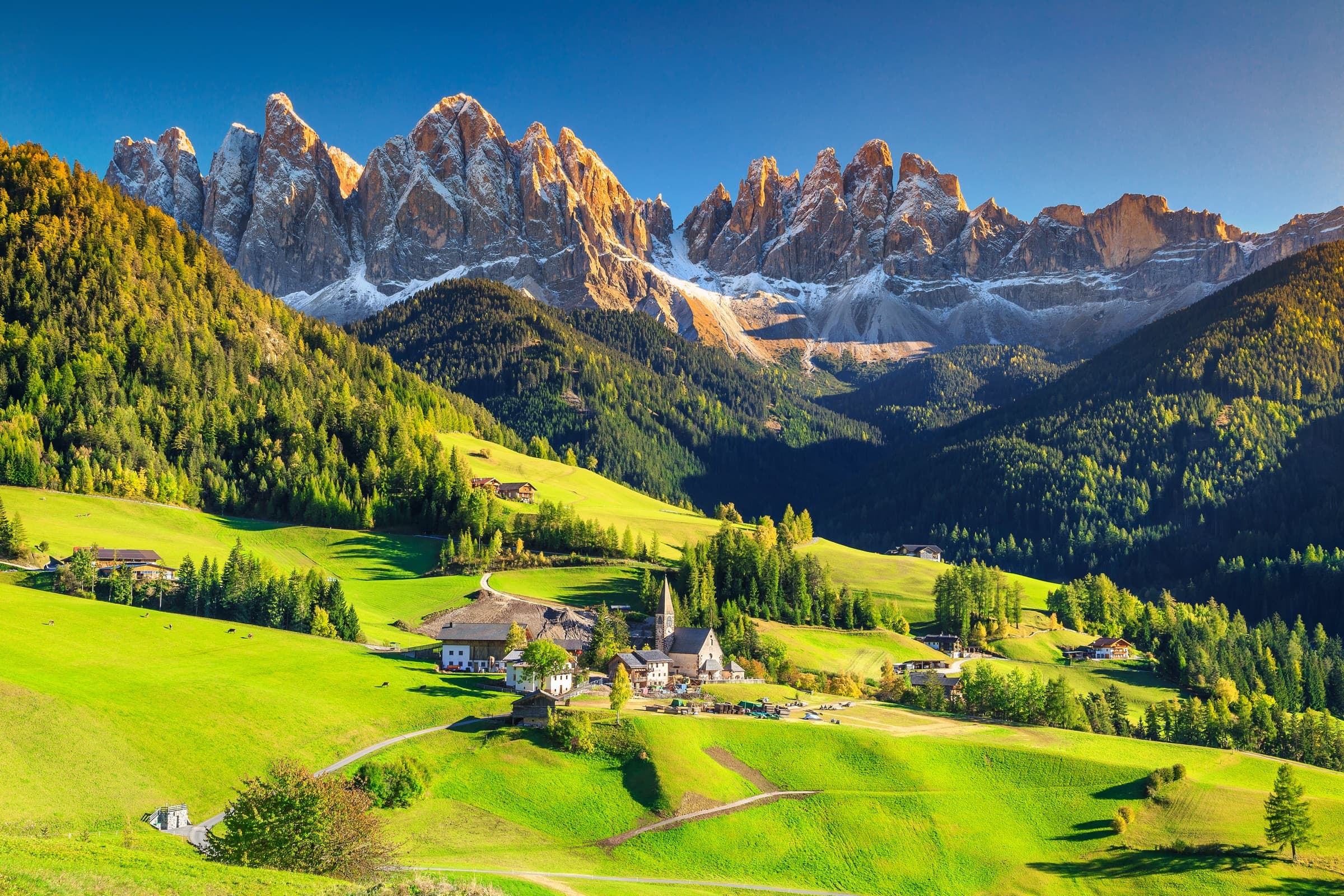 A small village beneath the Dolomites at the end of day