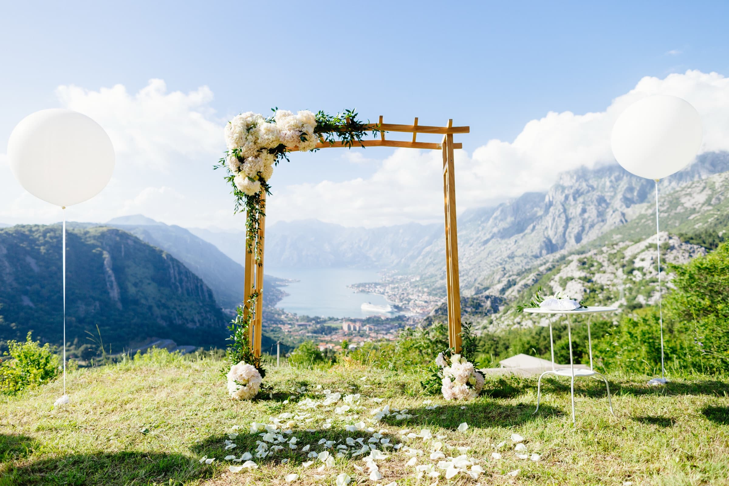A timber wedding arch overlooking the Bay of Kotor