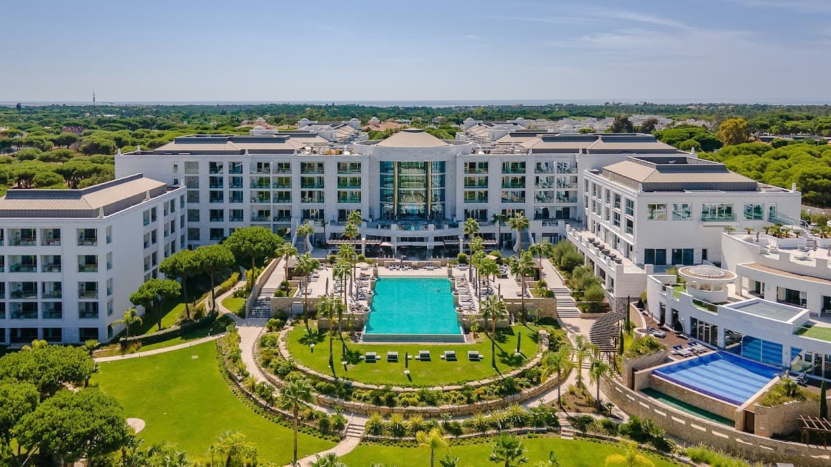 The white façade and gardens of Conrad Algarve at Quinta do Lago