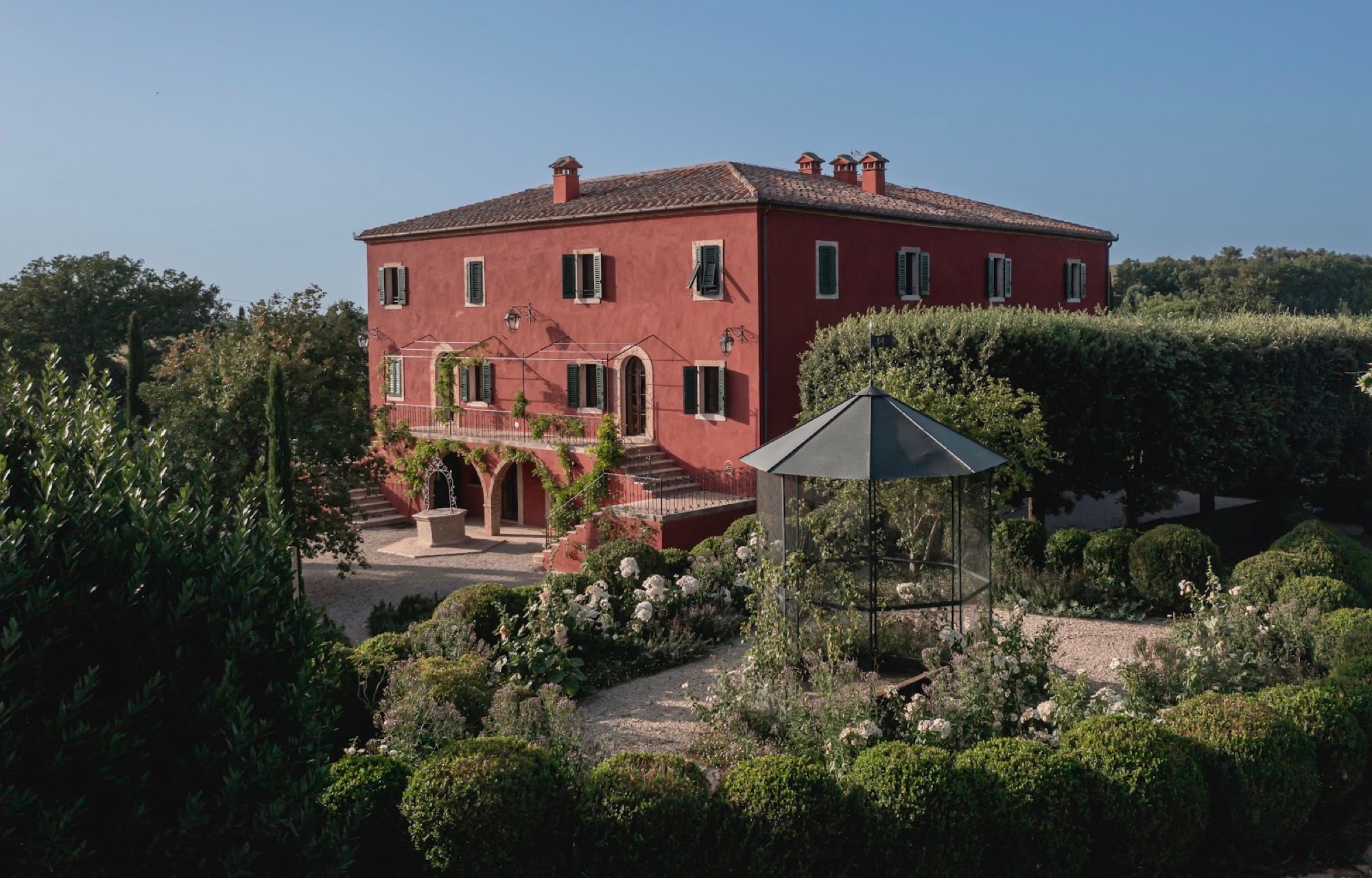 Casa Newton’s red villa above the Val d’Orcia near Pienza