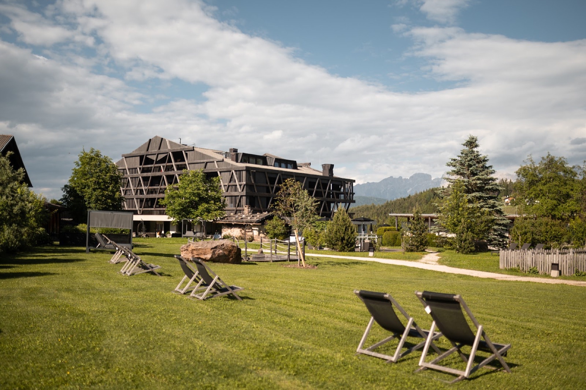 Hotel Pfösl’s charred-timber architecture facing the Rosengarten
