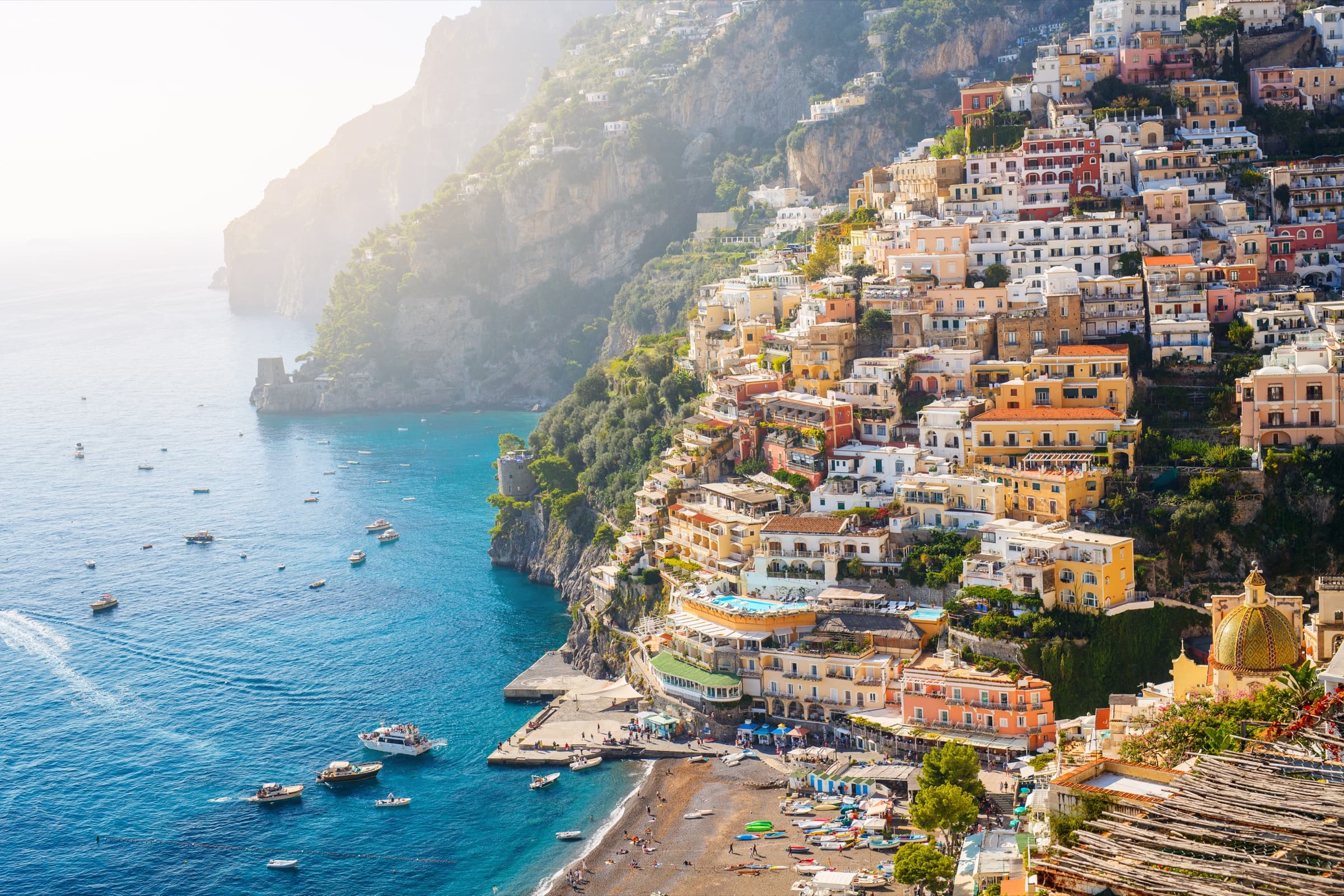 The Amalfi Coast of Italy, pastel cliffside villages above the Tyrrhenian Sea.