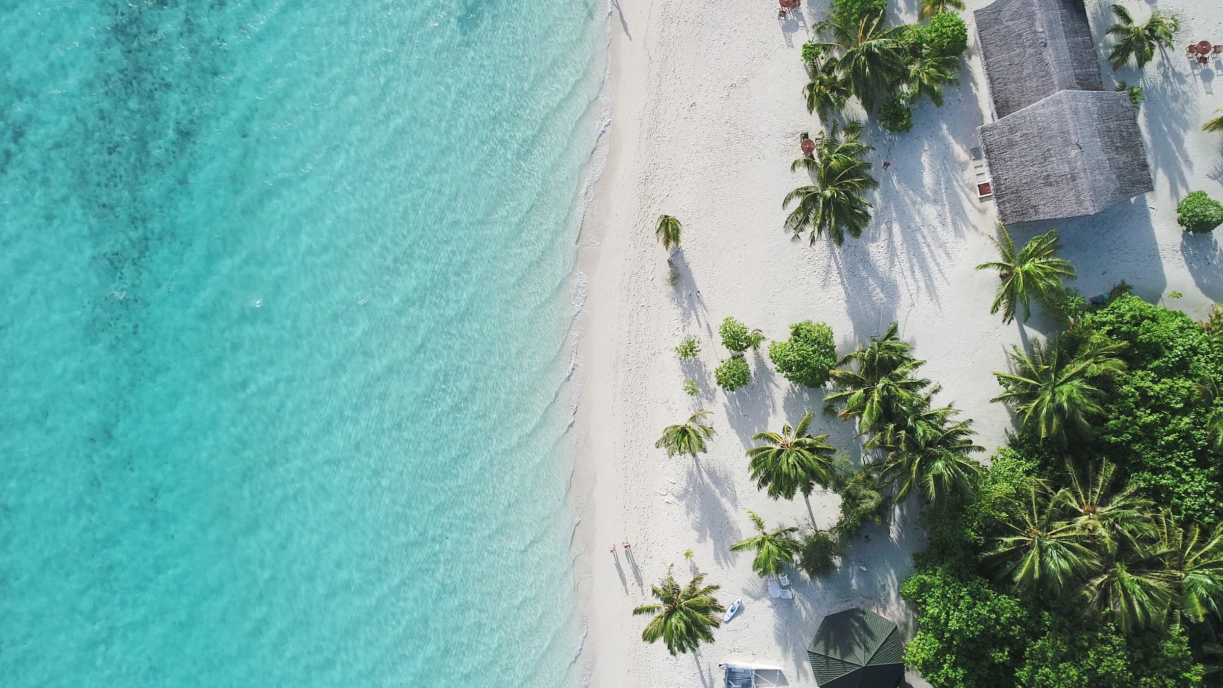 The Maldives, overwater villas above turquoise lagoons.