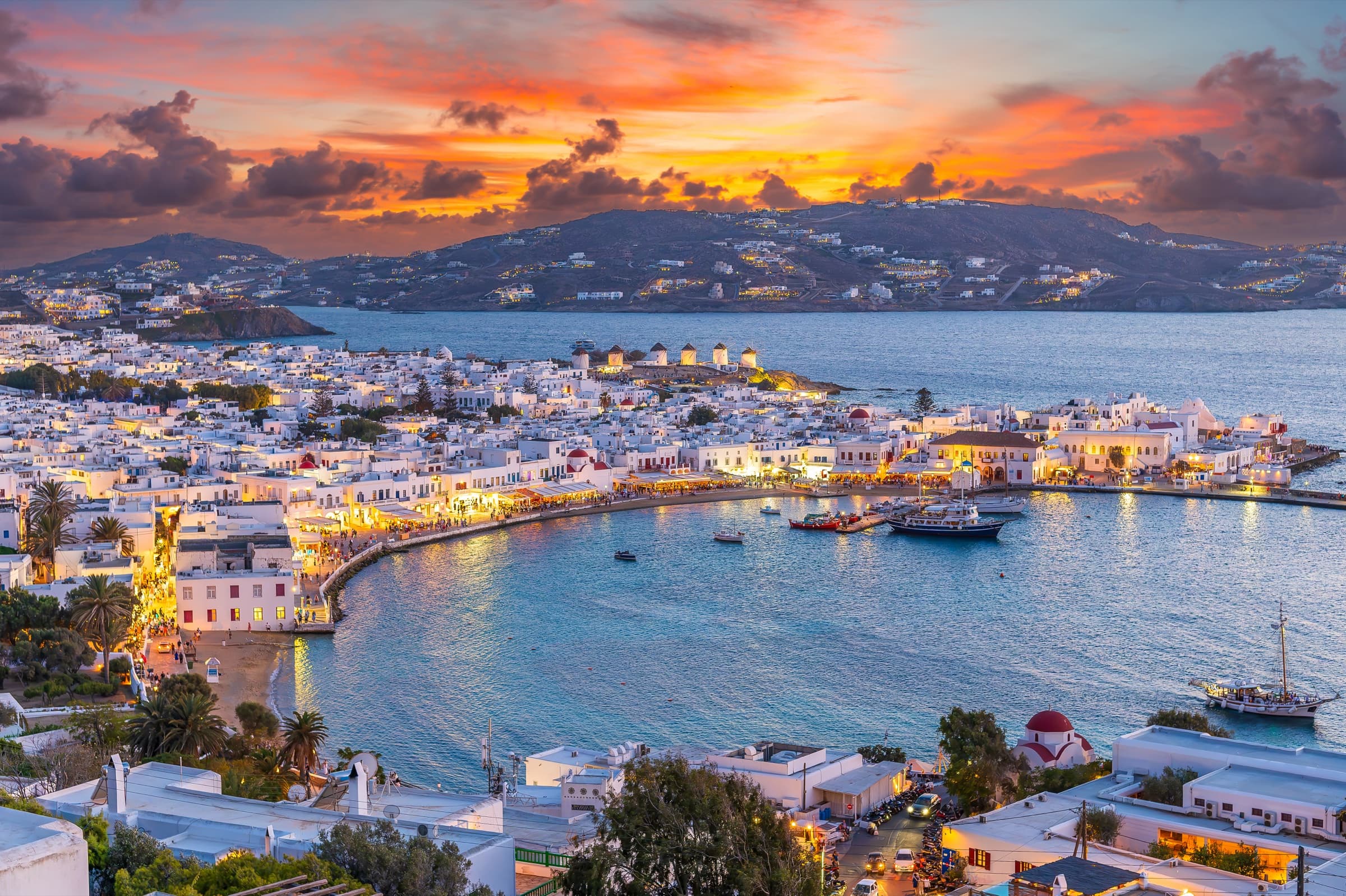 Mykonos, Greece, whitewashed buildings and Aegean sea views.