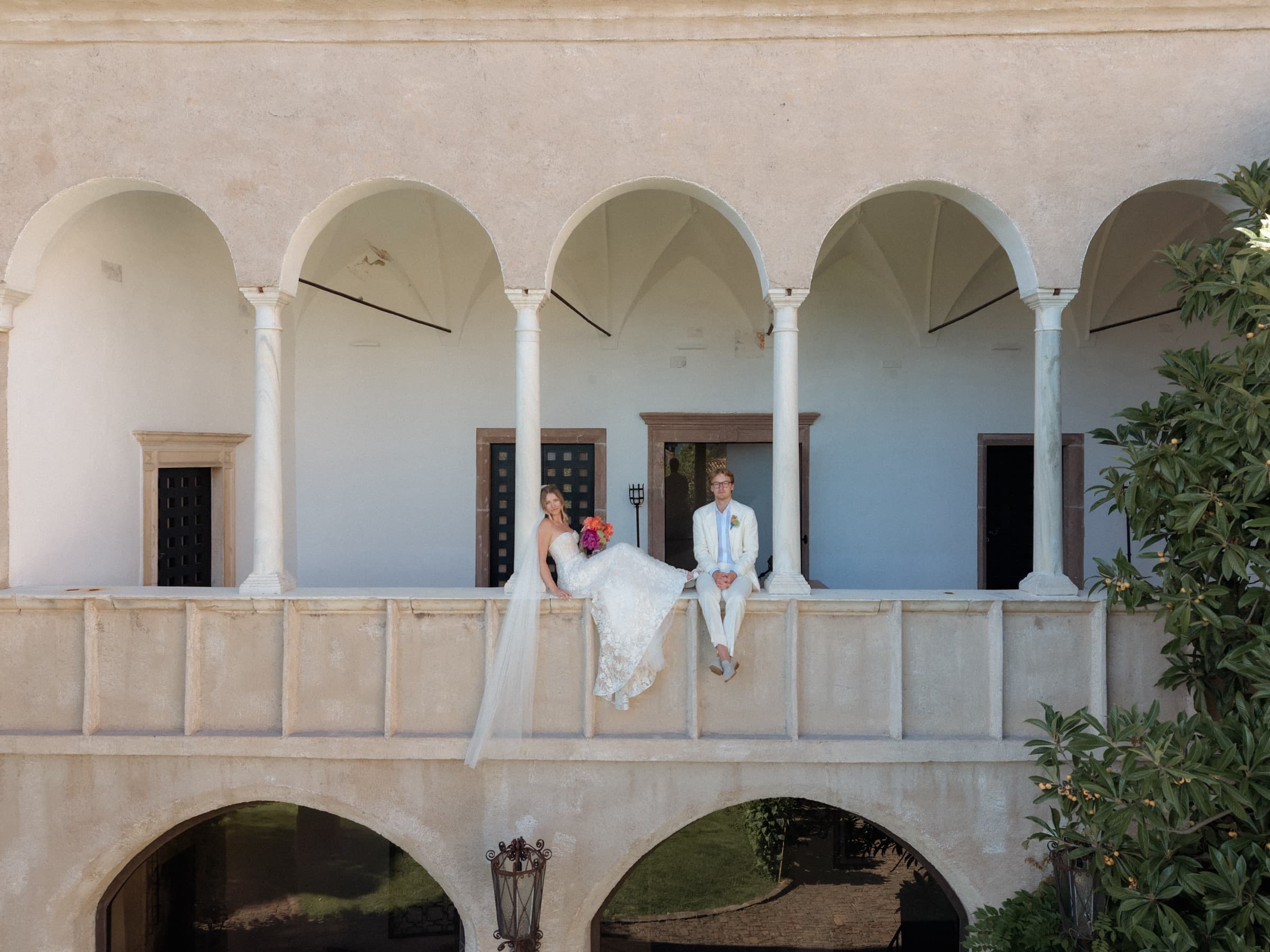 Perrie and Walt on their wedding day, on the arched loggia of Castel Fragsburg