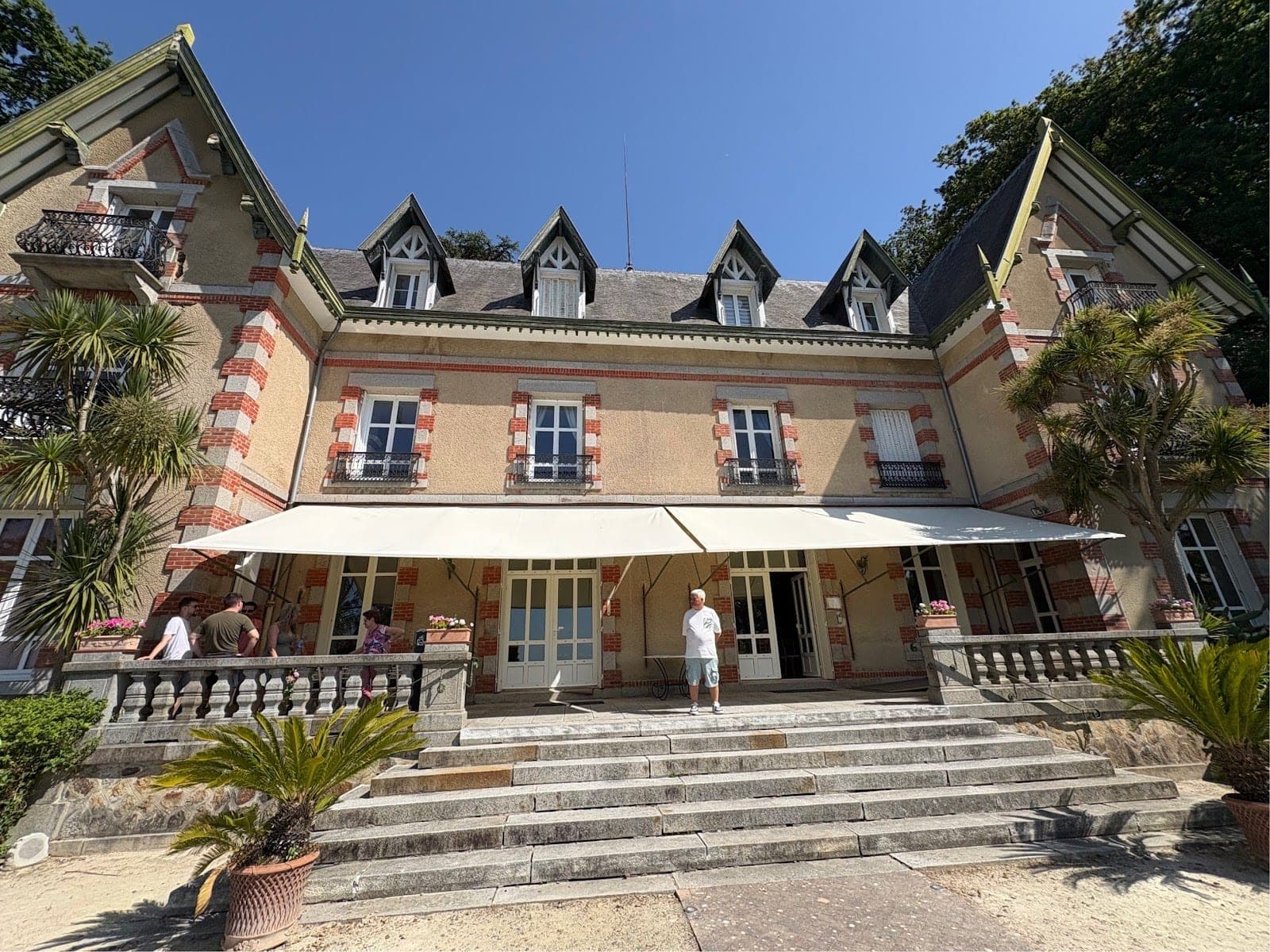 Exterior of a large building with a wide staircase leading to the entrance.