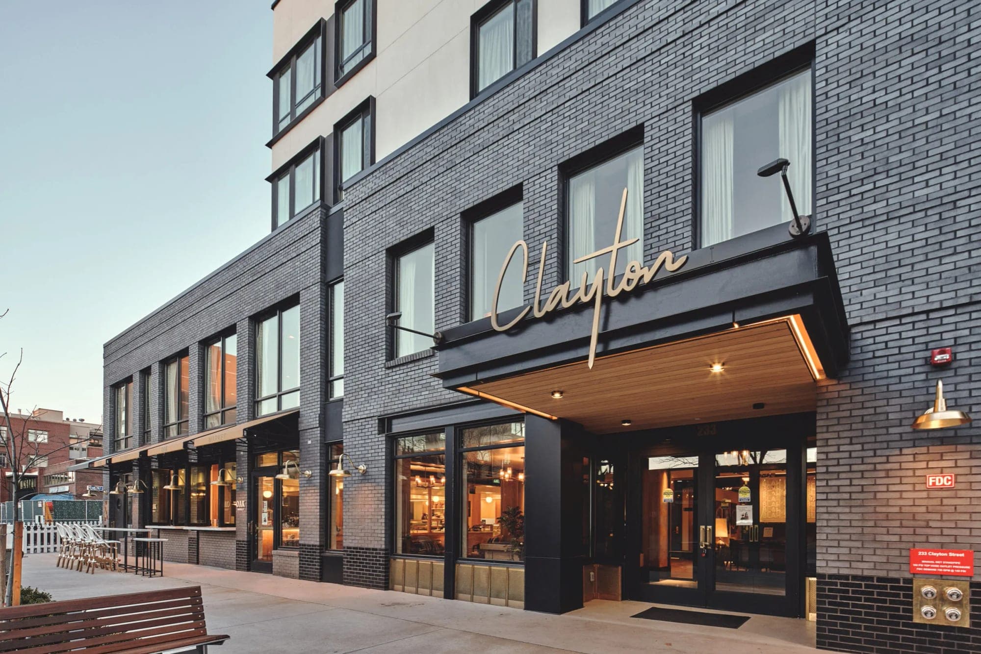 Exterior of the Clayton Hotel with its entrance and signage.