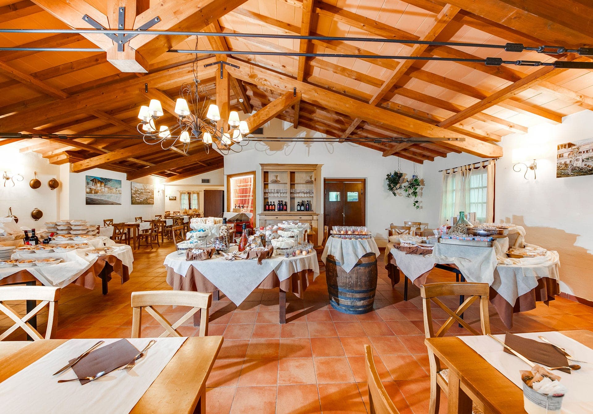 A reception room with buffet tables and chairs.