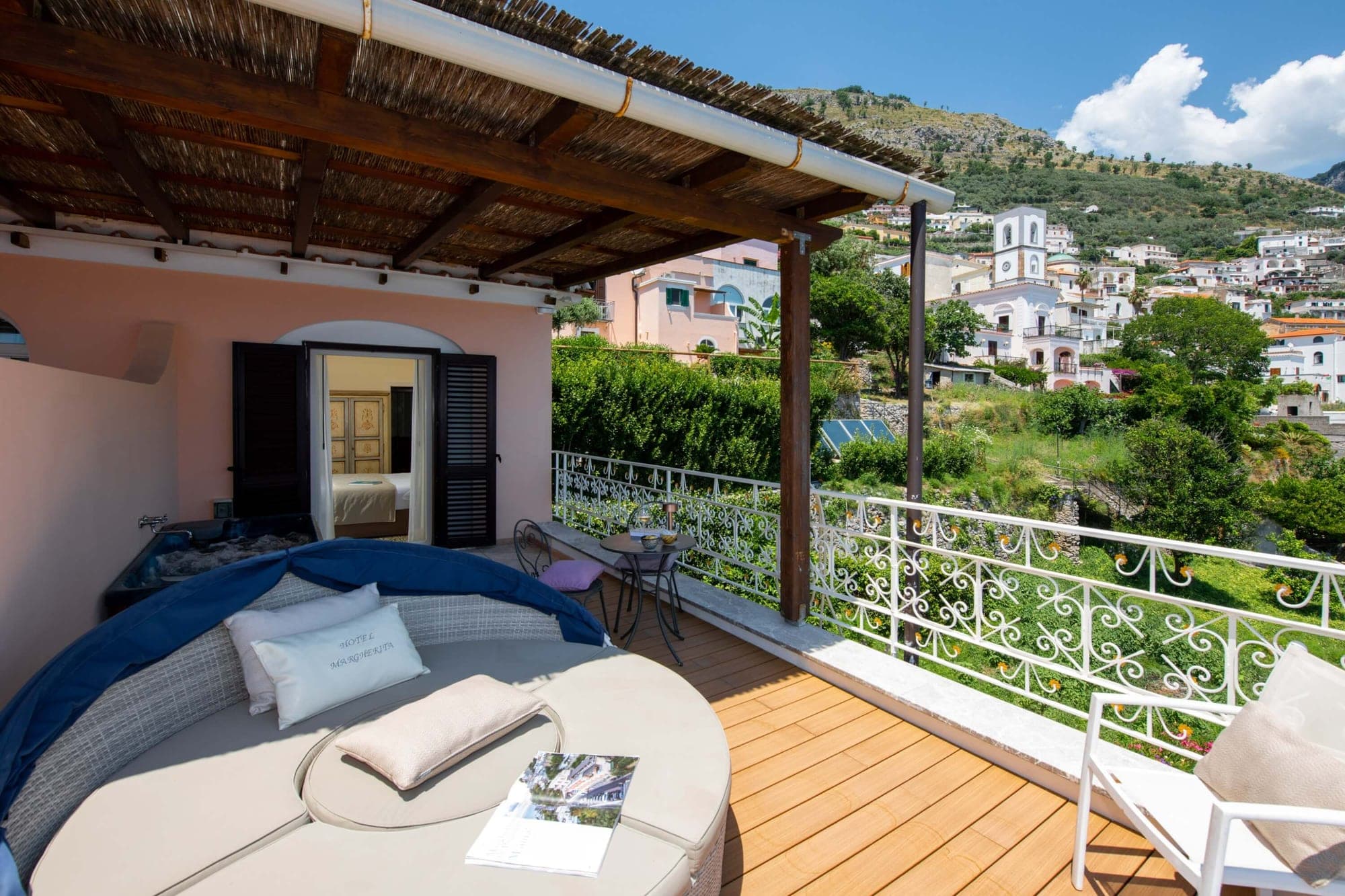 Balcony with daybed and view of Praiano town.