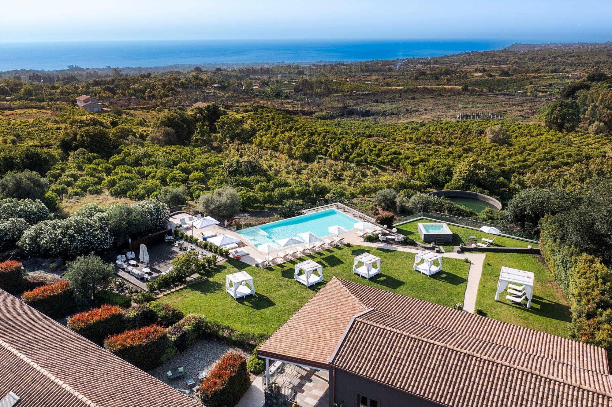 Aerial view of Kepos Etna Relais & Exclusive Spa with pool and gardens