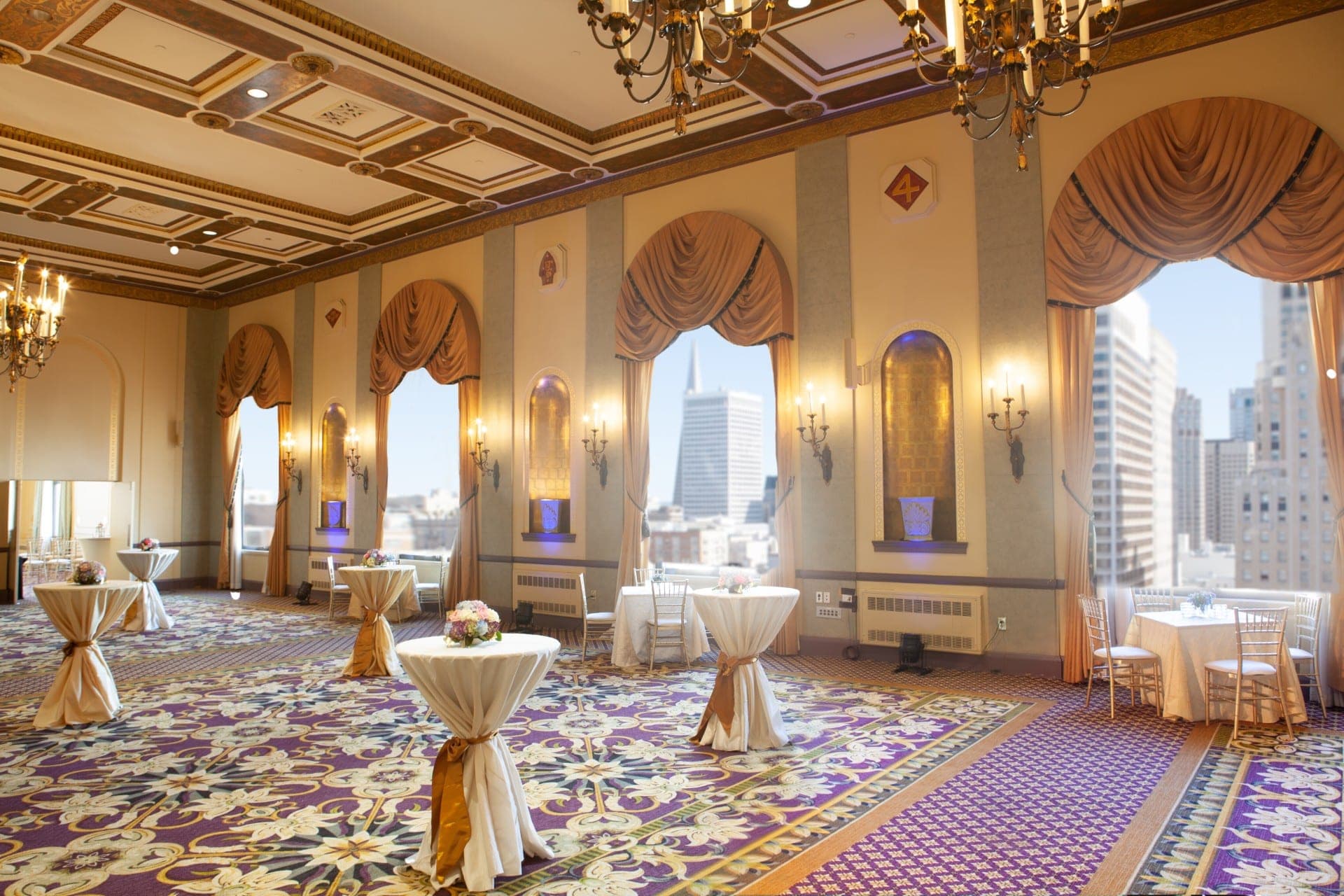 Reception room with cocktail tables and city view