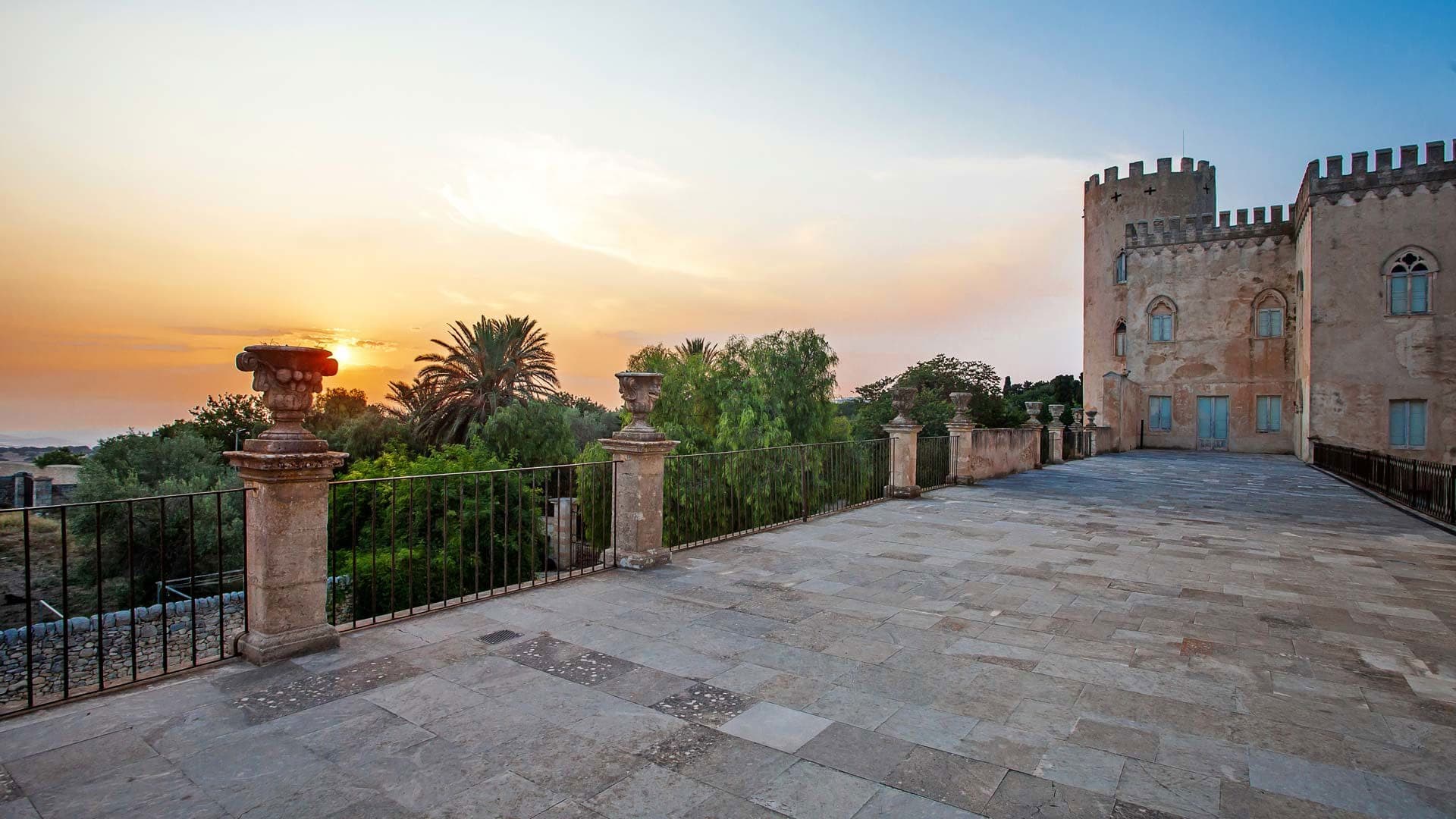 Terrace with a castle at sunset