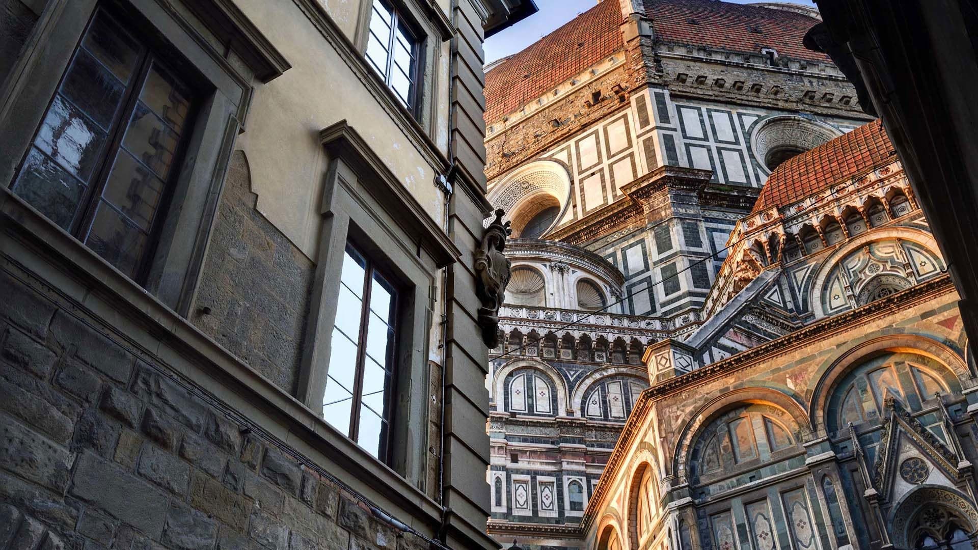 Close-up view of ornate architectural details of a building with a dome.