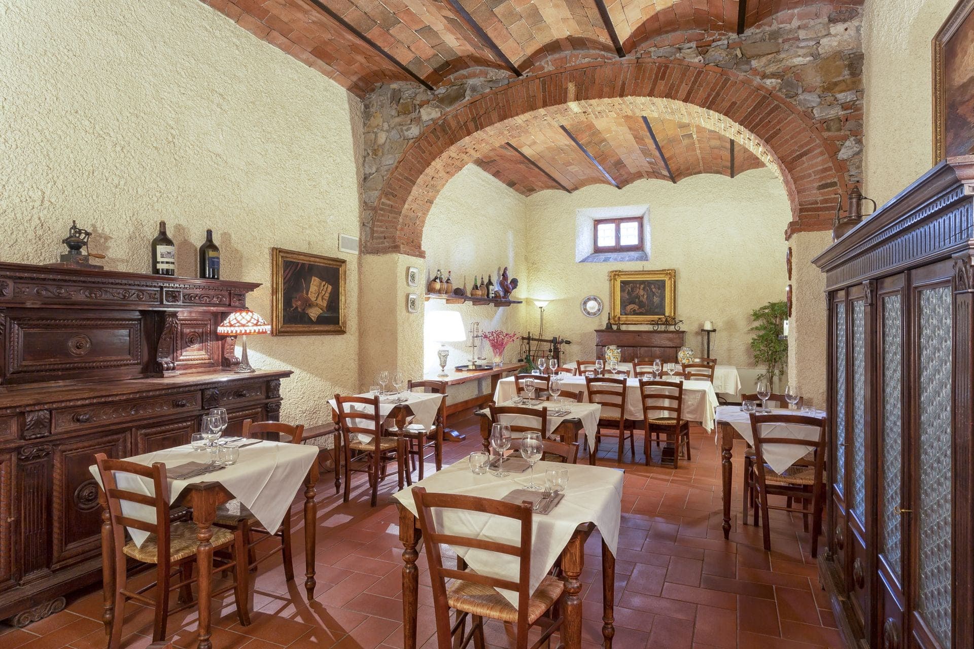 A dining room with tables set for a wedding reception.