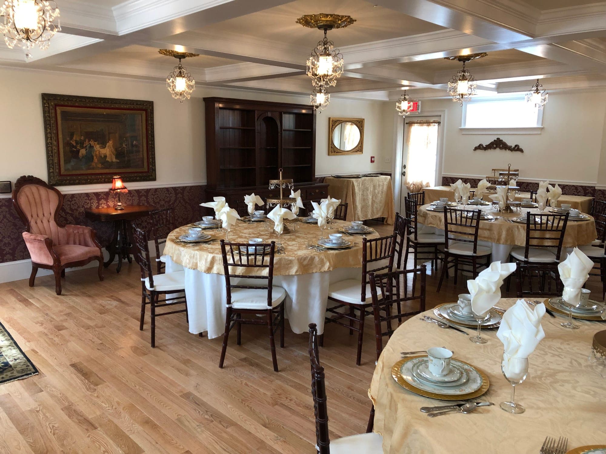 Dining room with round tables set for a wedding reception.