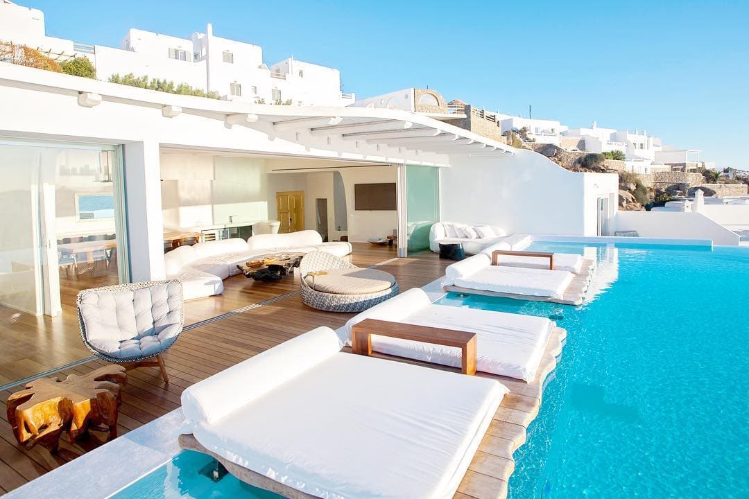 White cliffside cubes and the infinity pool at Cavo Tagoo above the sea near Mykonos Town