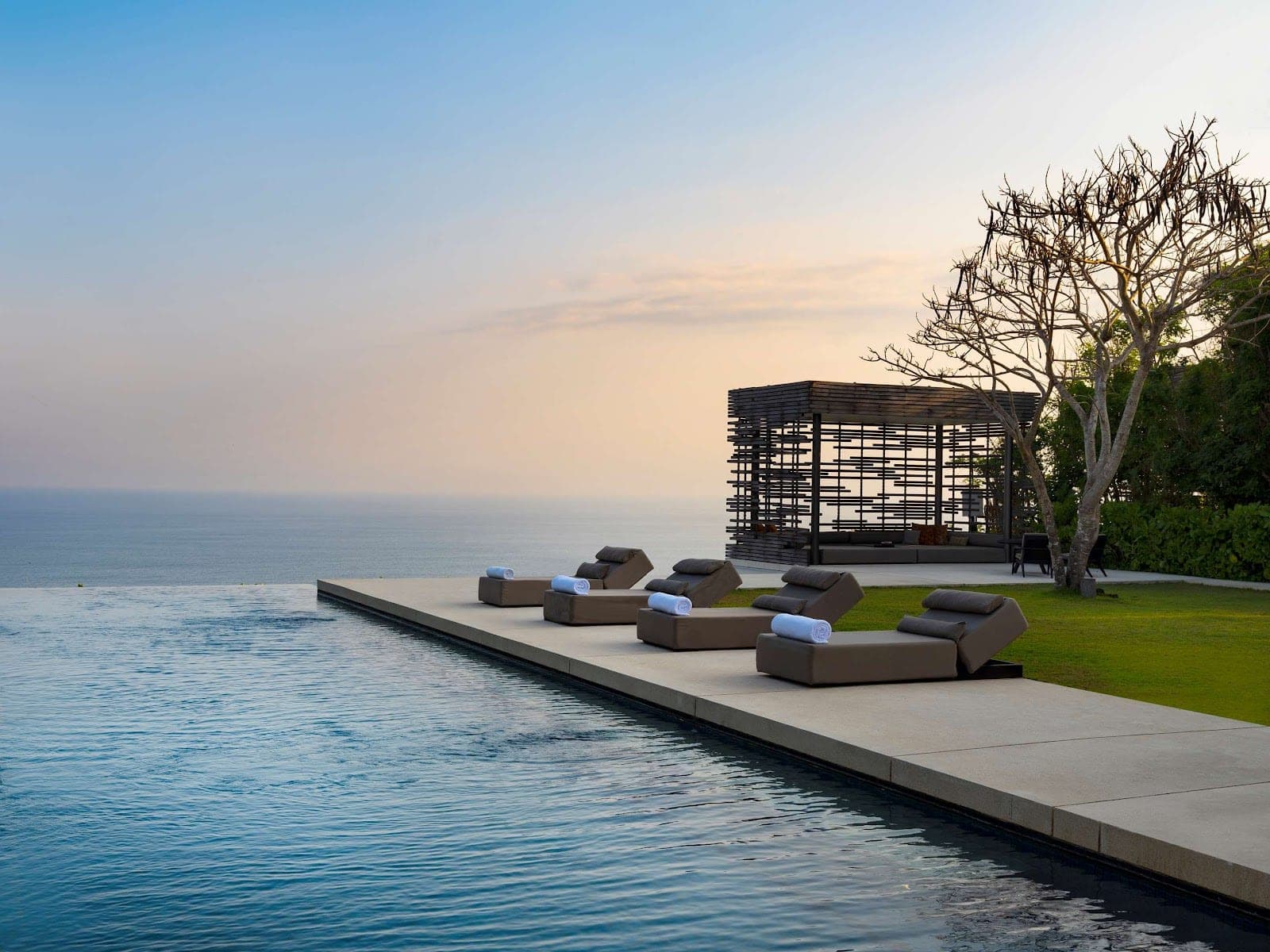 Alila Villas Uluwatu, a stone clifftop resort stepping down a limestone headland above the Indian Ocean