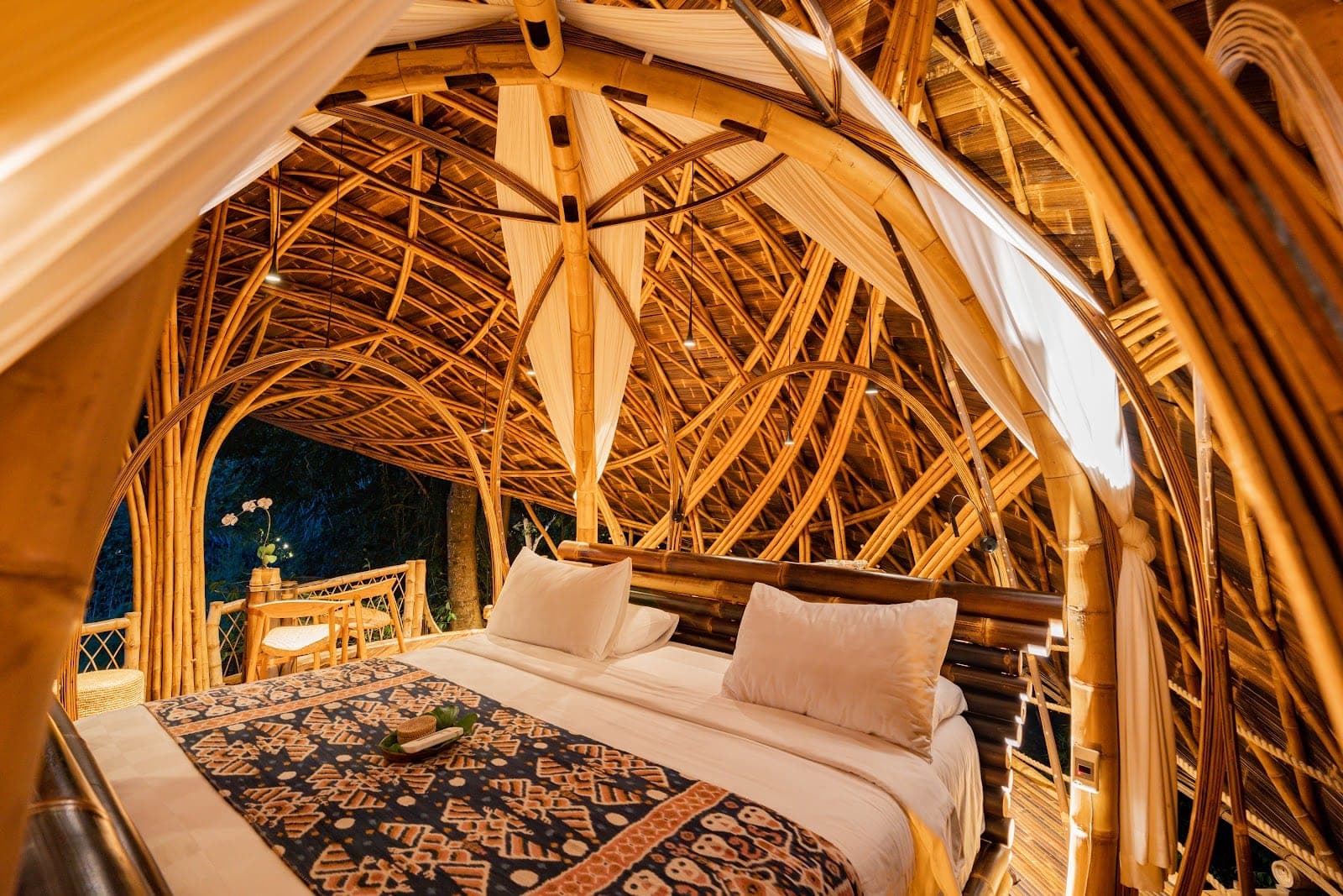 Bambu Indah near Ubud, antique Javanese teak bridal houses and bamboo structures on a ridge above the Ayung