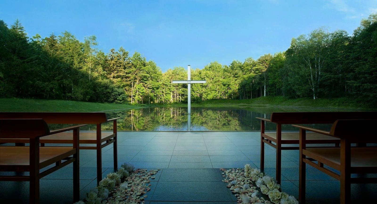 Tadao Ando’s Chapel on the Water at Tomamu, its cross standing in the pond