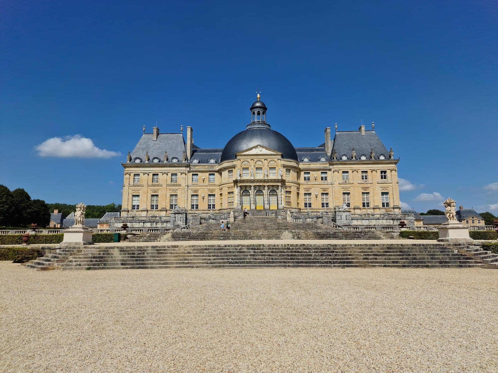 The dome and moat of Château de Vaux-le-Vicomte above its Le Nôtre parterres