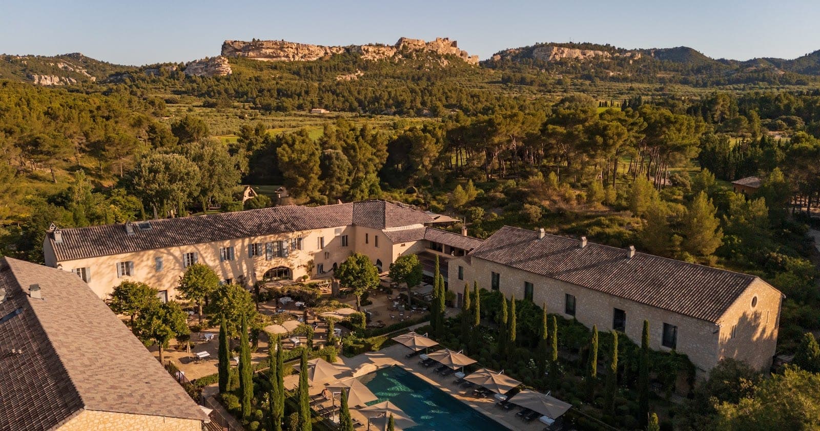 The stone mas and courtyard of Domaine de Manville below the village of Les Baux-de-Provence