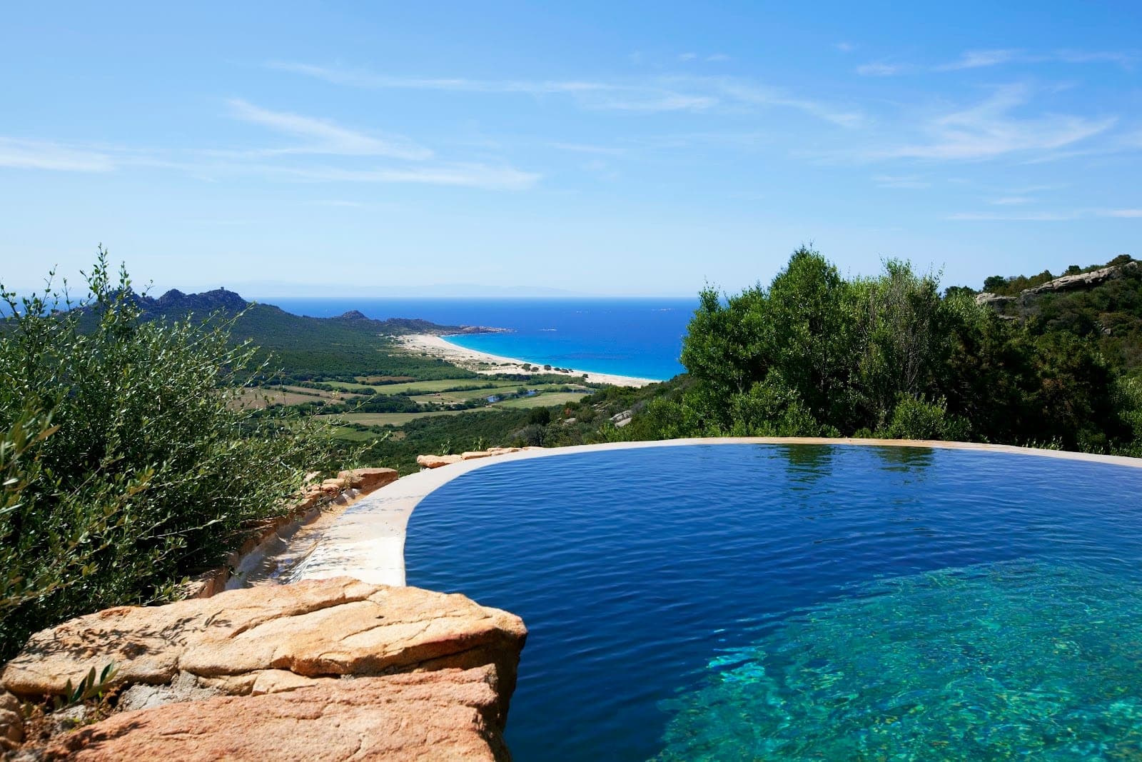 A restored stone bergerie above the maquis and the sea at Domaine de Murtoli in southern Corsica