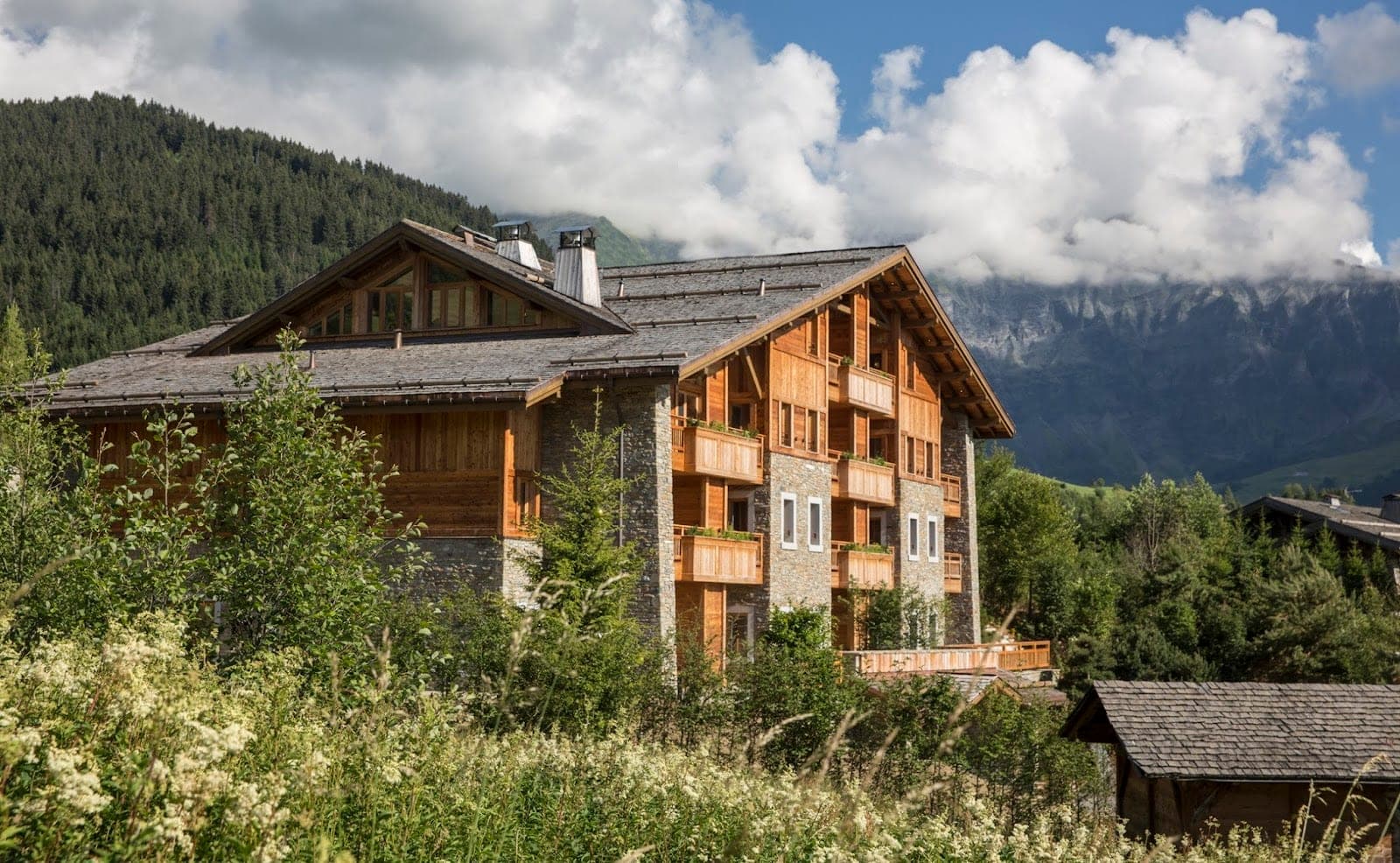 A chalet terrace at Four Seasons Megève looking across the valley to the Mont Blanc massif