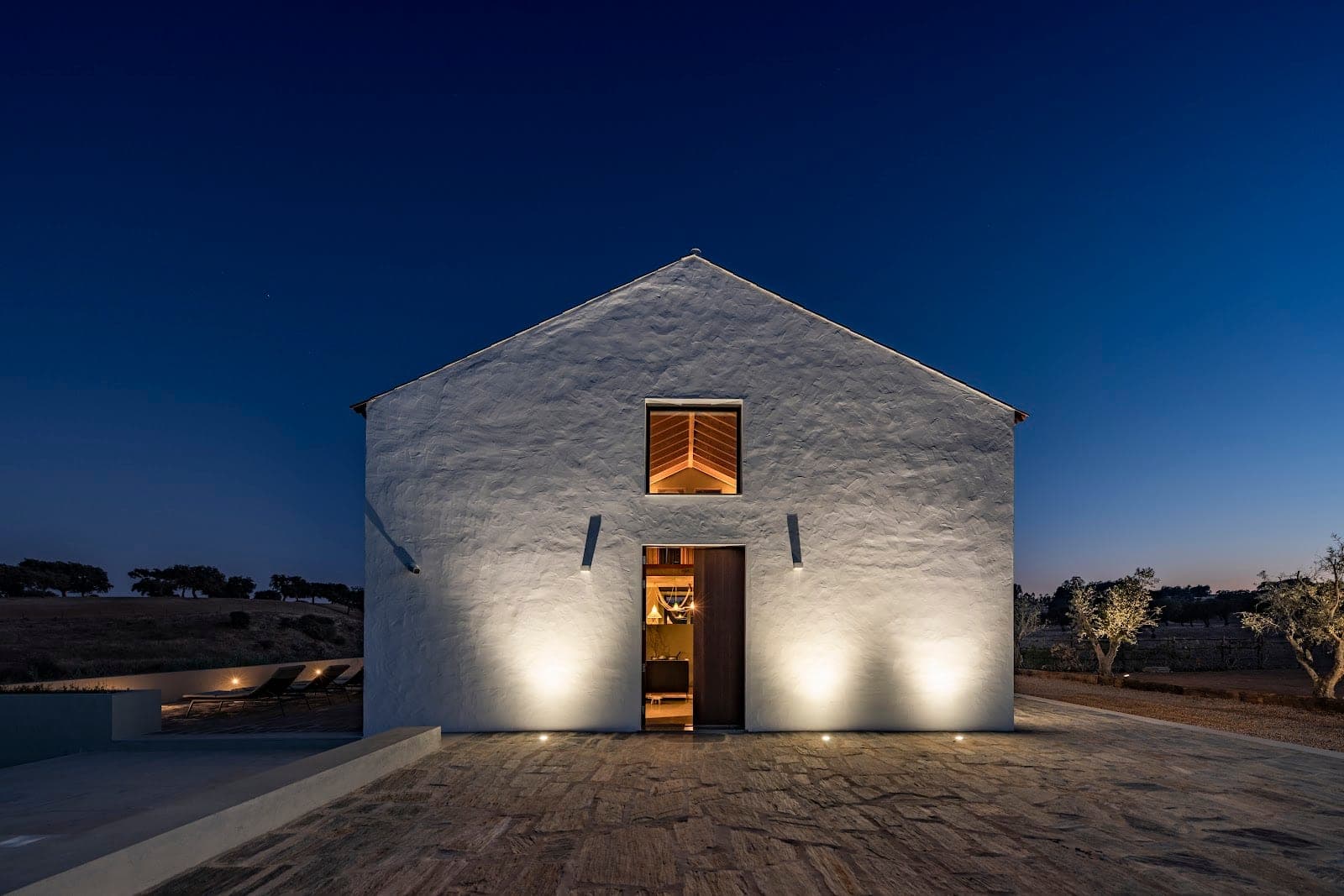 Vineyards and the whitewashed farm buildings of Herdade da Malhadinha Nova in the Alentejo