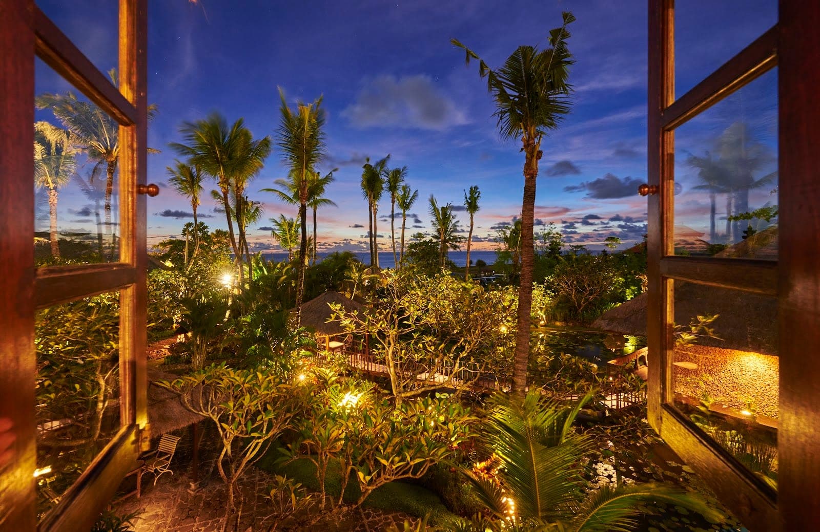 Hotel Tugu Bali in Canggu, its red Bale Sutra temple room hung with antique Indonesian art