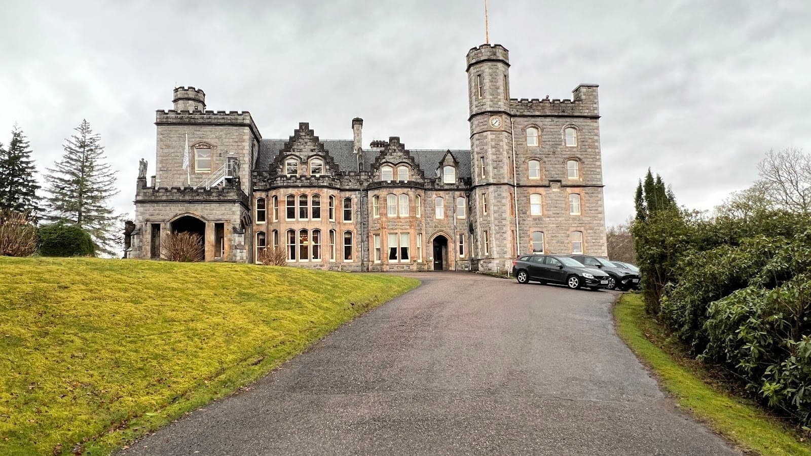 Inverlochy Castle hotel below Ben Nevis with its loch and gardens in the foreground