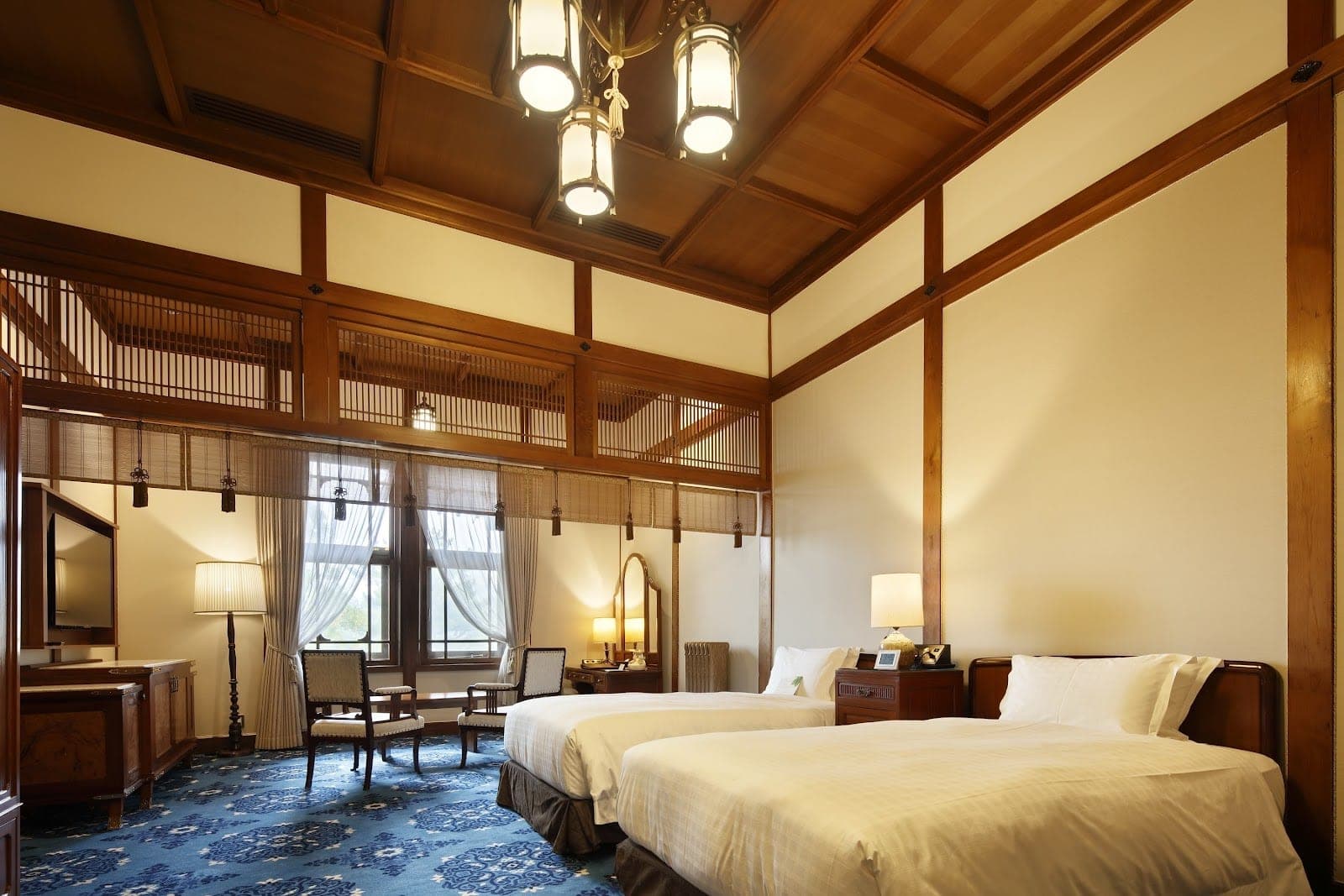 The 1909 hinoki cypress main building of the Nara Hotel above Nara Park
