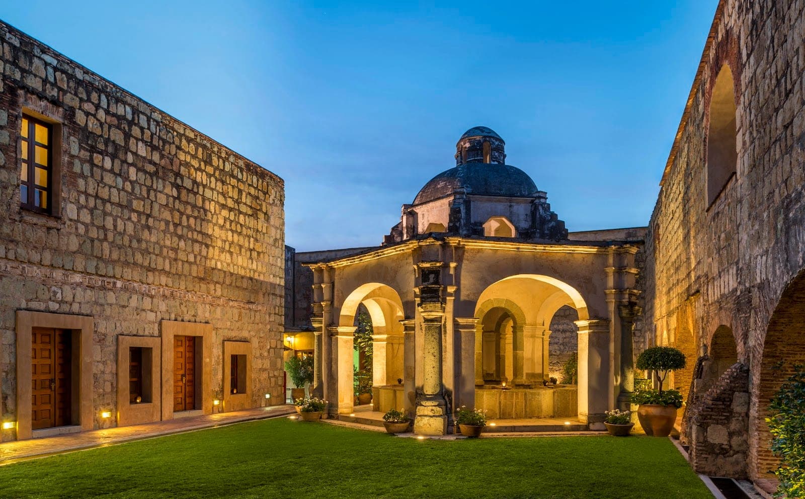 The stone cloister and central fountain of Quinta Real Oaxaca, the former Santa Catalina convent of 1576