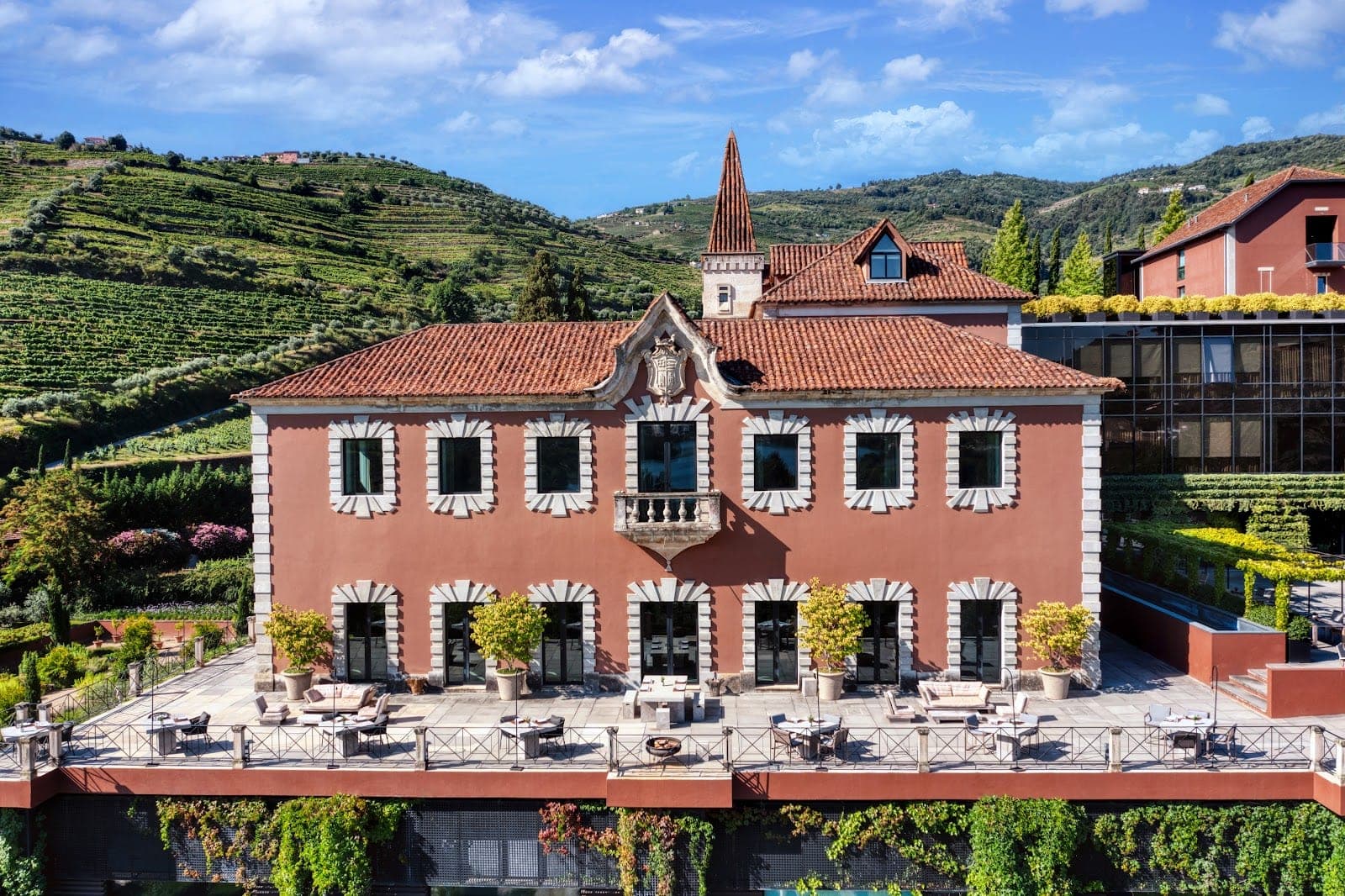 The 19th-century manor and vine terraces of Six Senses Douro Valley above the river