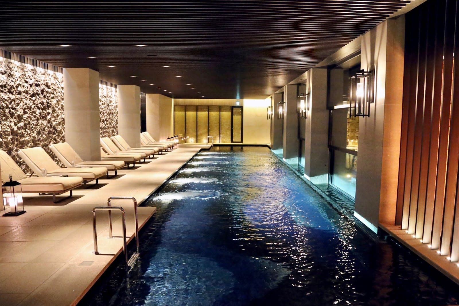 The Ritz-Carlton, Kyoto on the Kamo river with the Higashiyama ridge behind it