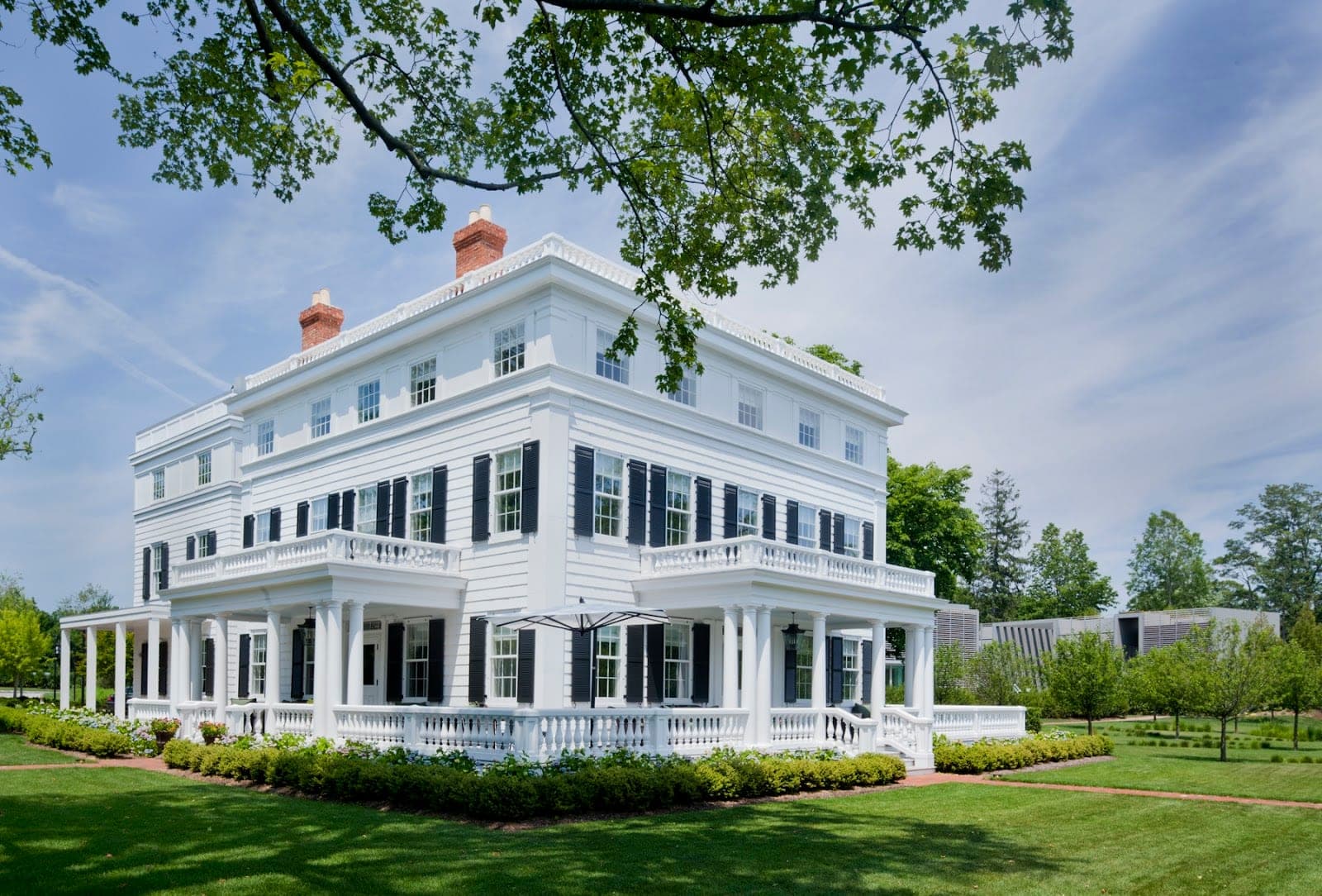 The 1842 Greek Revival Topping Rose House and its lawn in Bridgehampton, New York