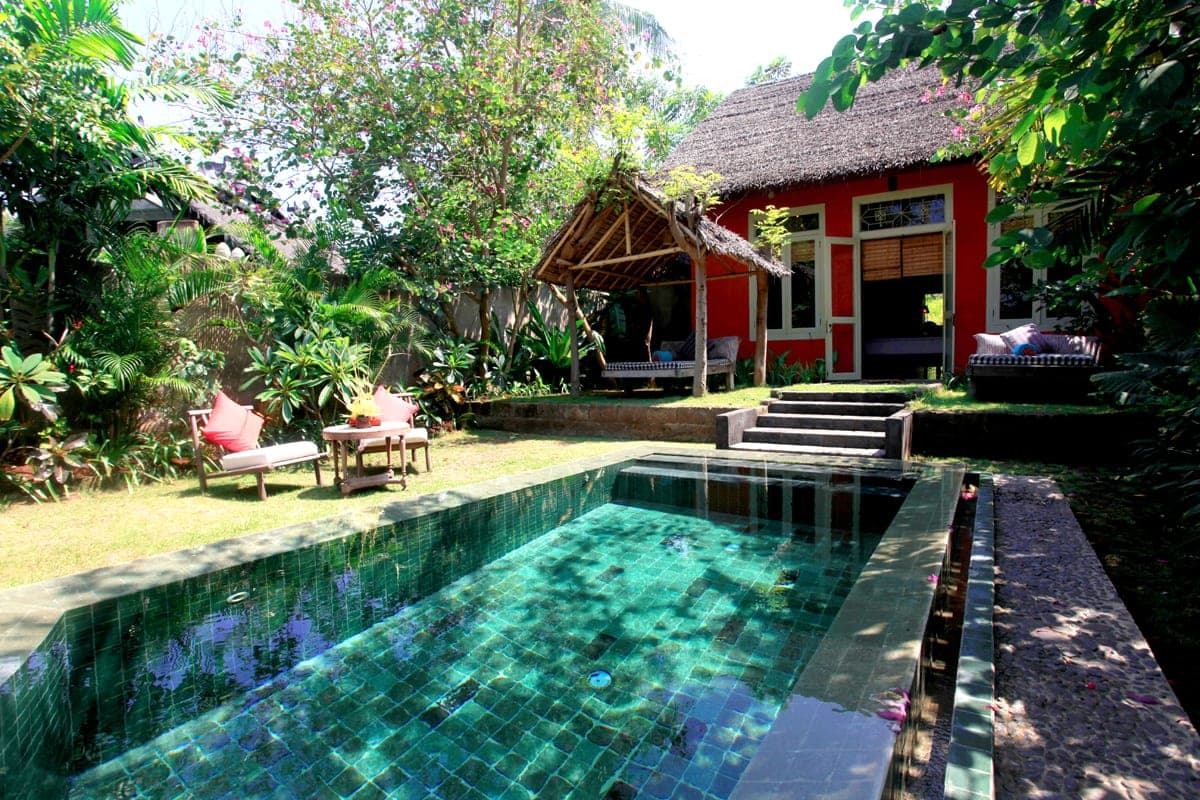 Hotel Tugu Lombok on Sire beach, its thatched Bale Kokok Pletok hall above a lotus pond facing the sea