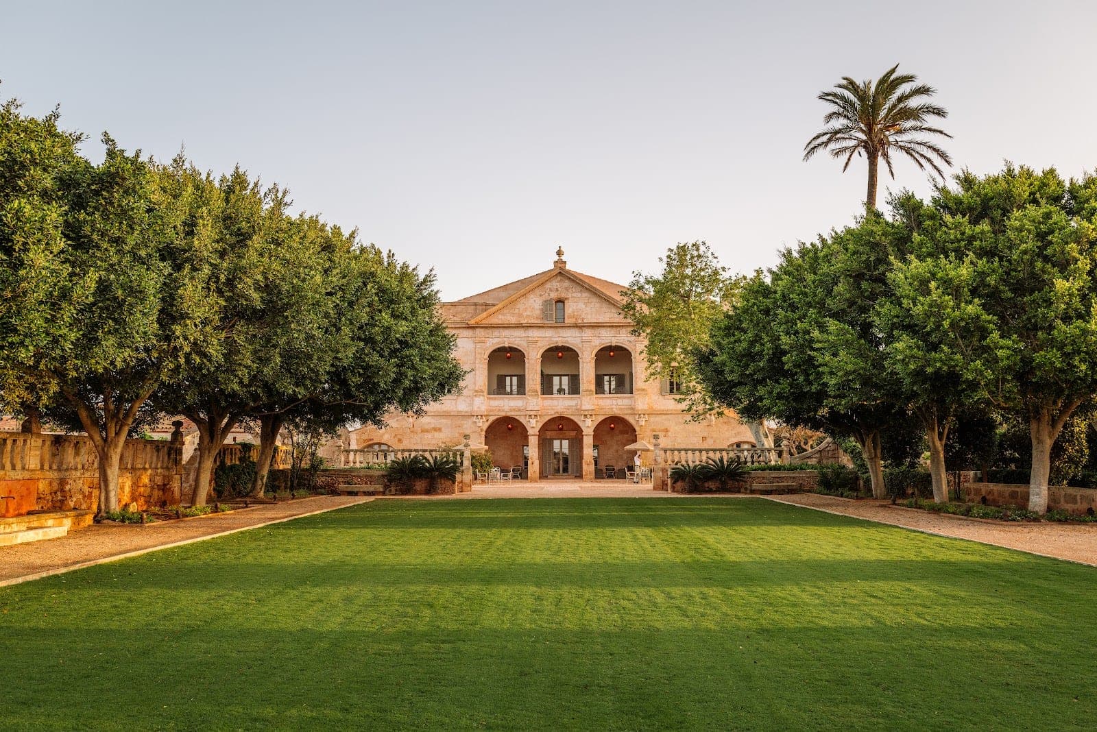The honey-coloured manor house and gardens at Vestige Son Vell in Menorca