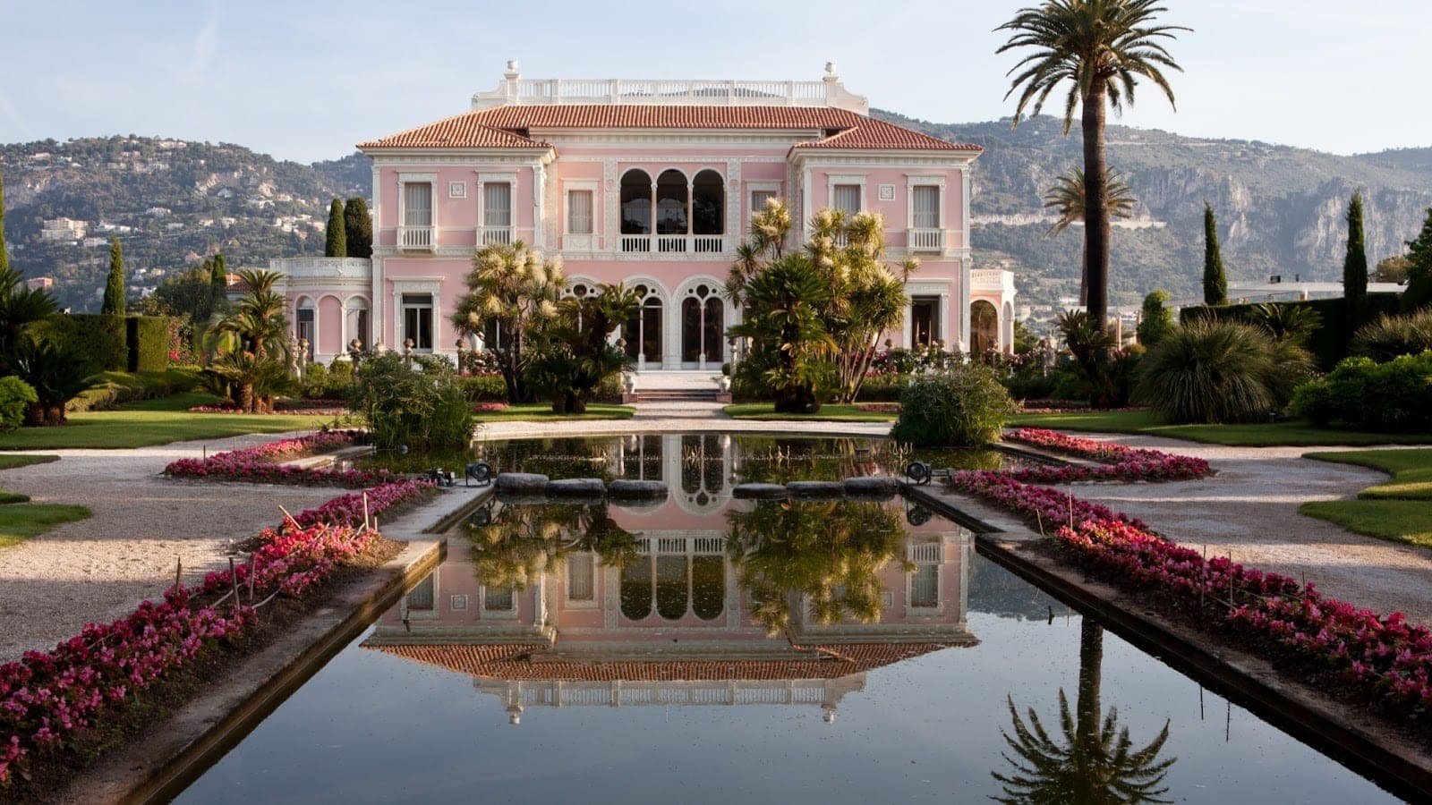 The pink Villa Ephrussi de Rothschild above its formal garden on Cap-Ferrat