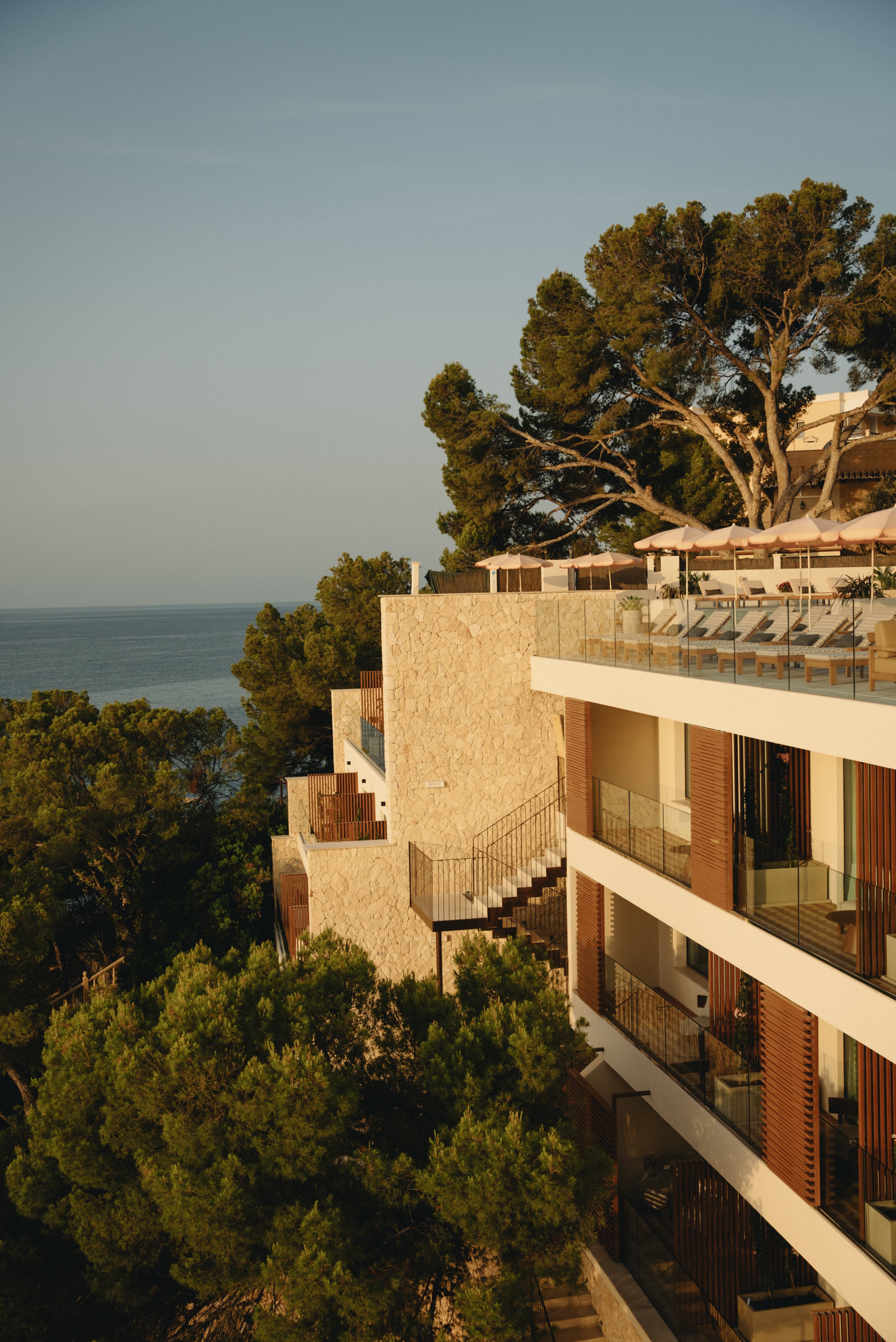 Aethos Mallorca hotel exterior at sunrise, Peguera