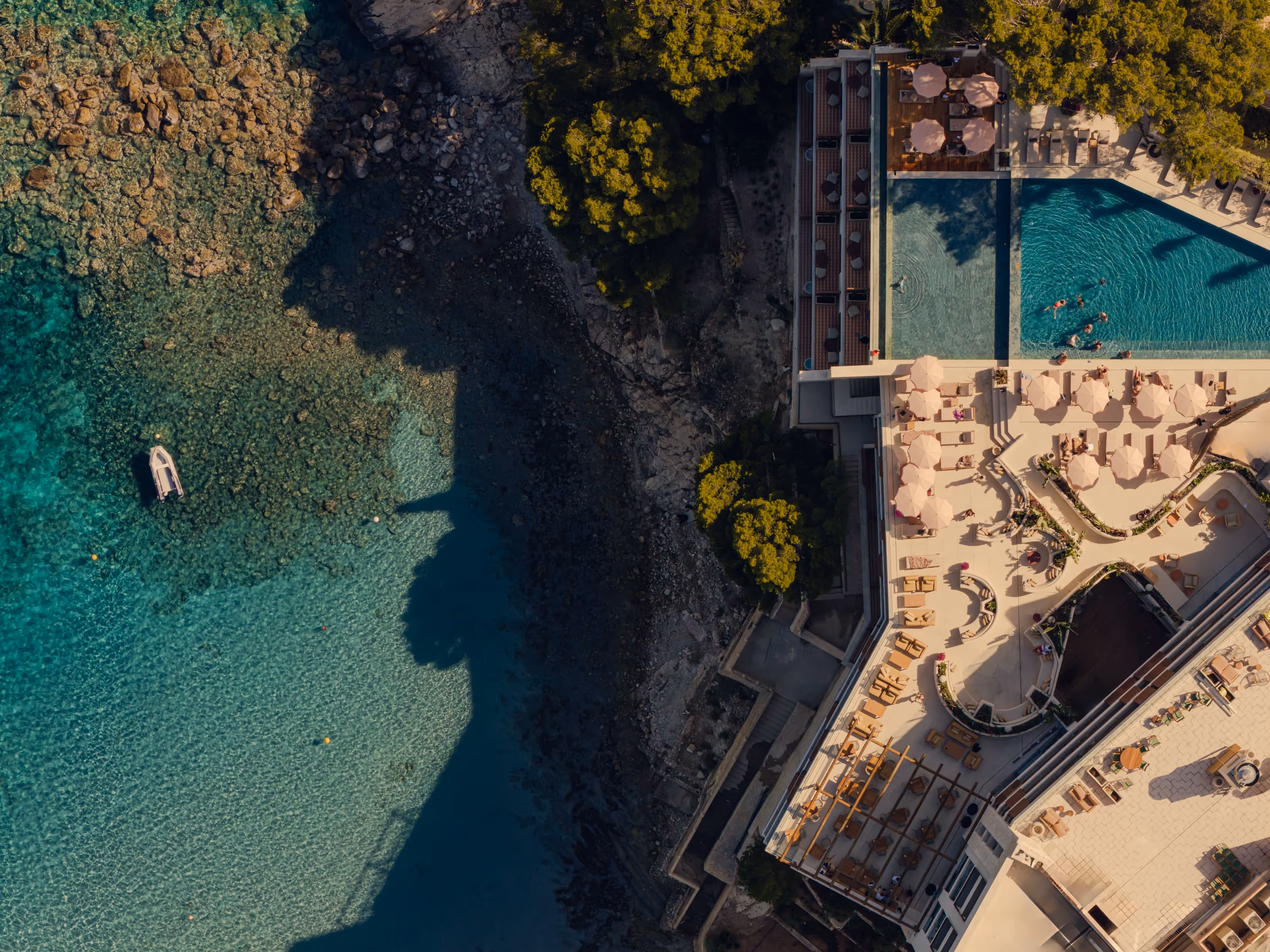 Aethos Mallorca hotel exterior at sunrise, Peguera
